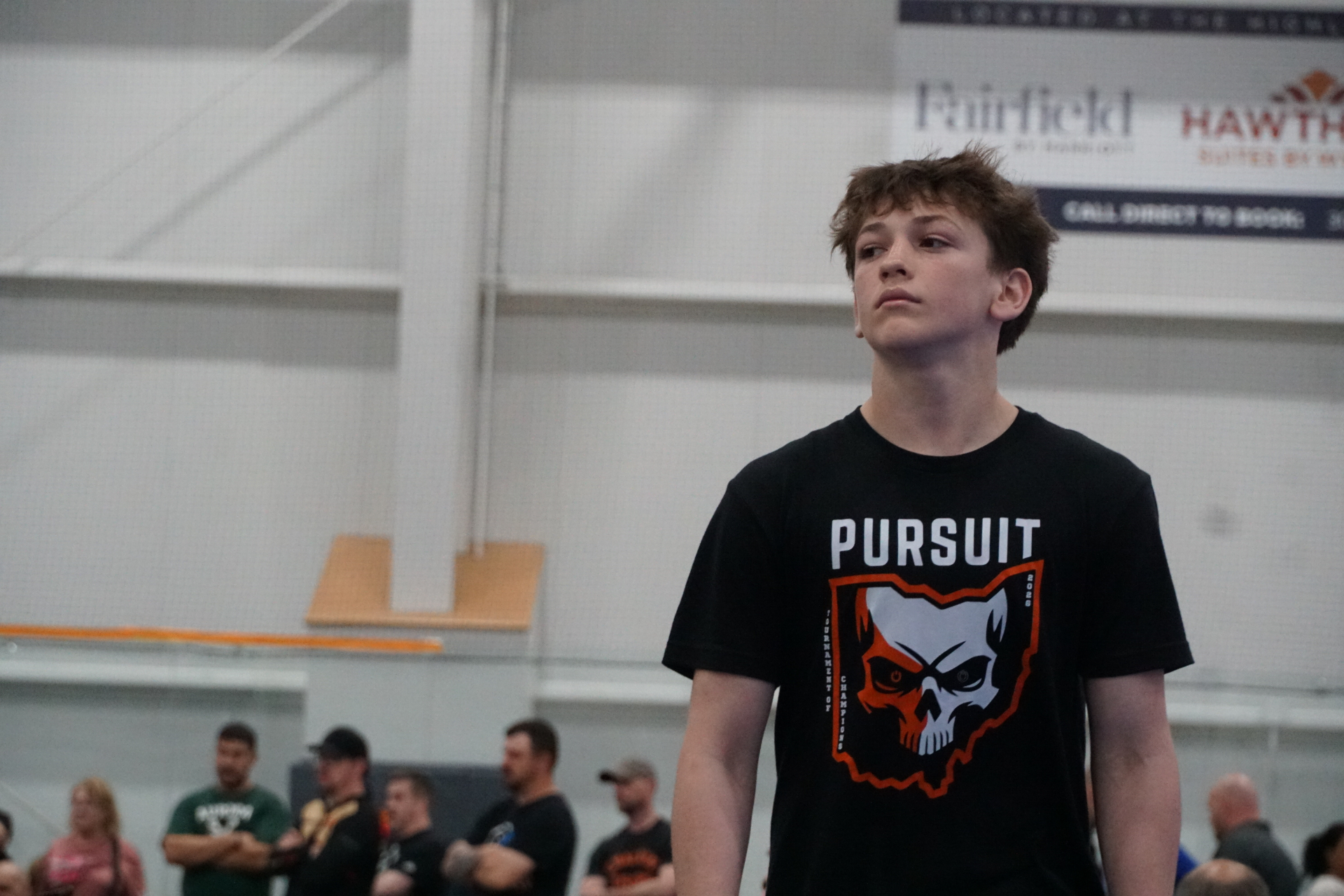 Wrestler standing confidently before a match