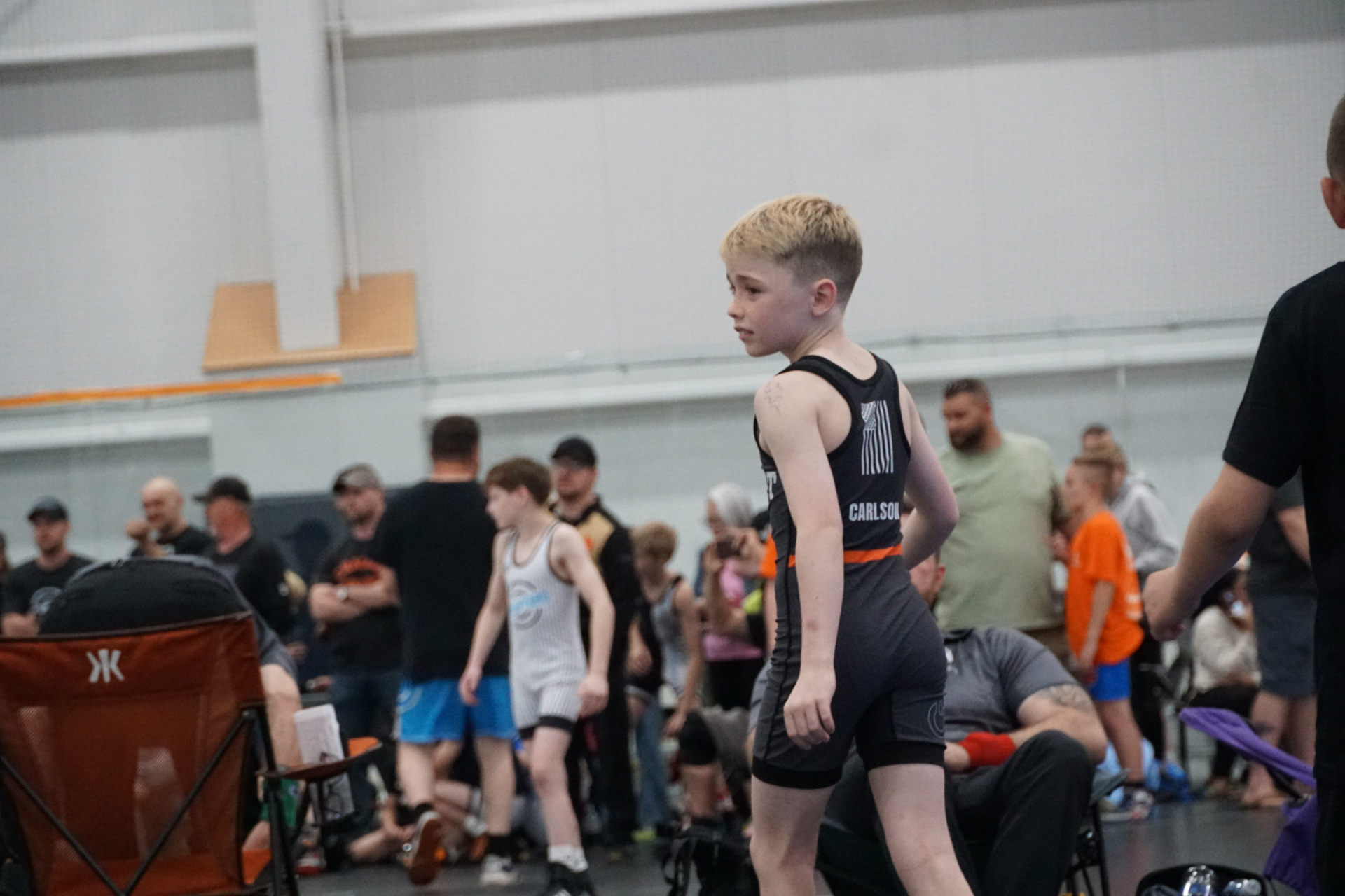 Young wrestler walking through the tournament venue