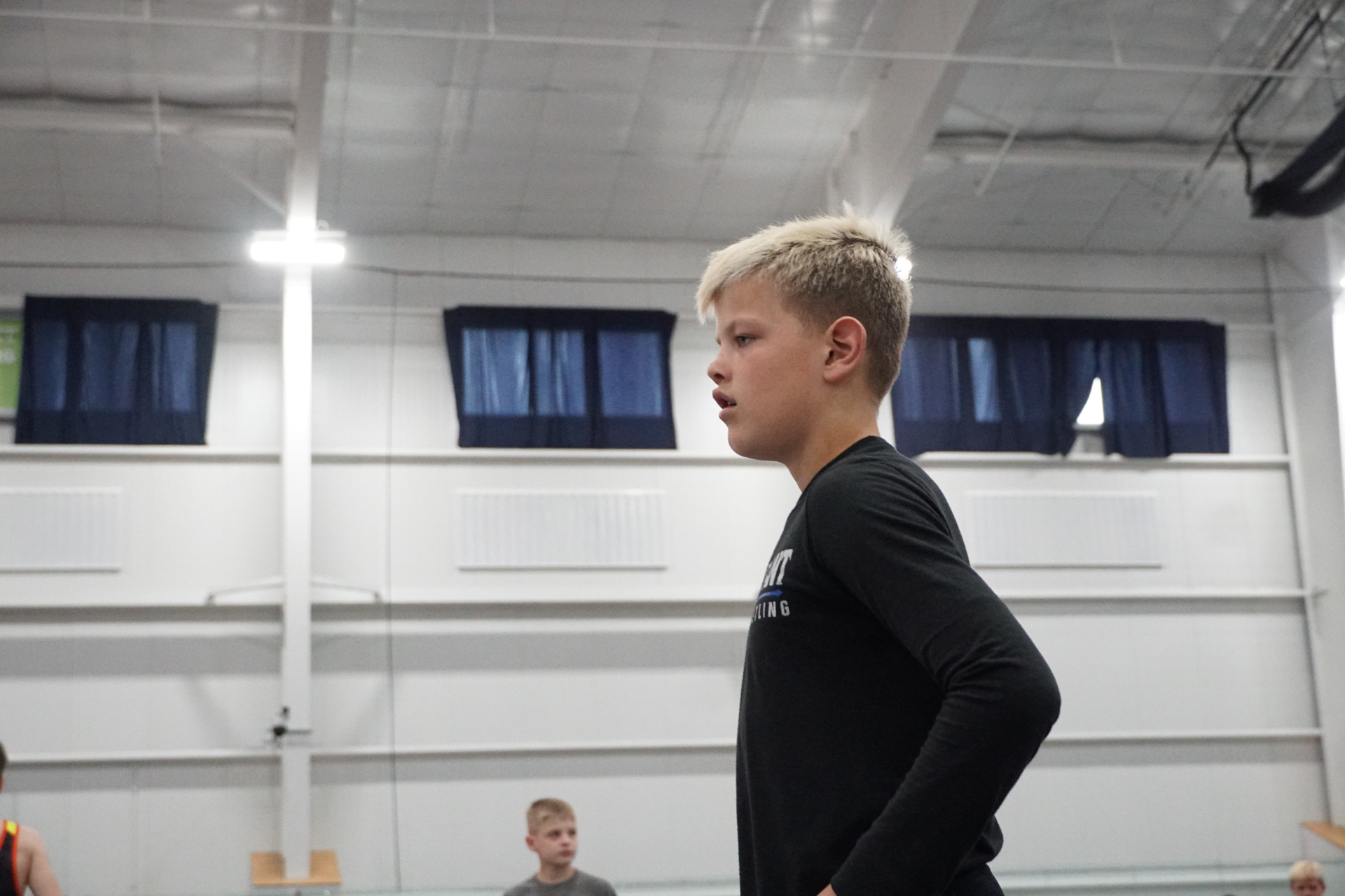 Young wrestler warming up on the tournament floor